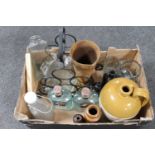 A box of stoneware flagon, glass bottles, metal wine rack,