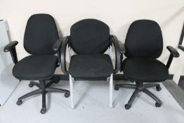 Two adjustable swivel office armchairs and two further office chairs