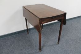An inlaid mahogany flap sided table fitted a drawer