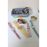 Sixteen assorted lady's and gent's wristwatches including two Swatch watches, Accurist, DKNY,