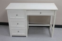 A contemporary four drawer dressing table