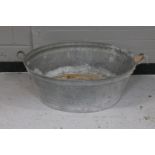 A galvanized wash tub