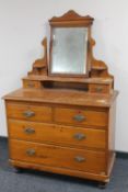 An antique pine dressing chest