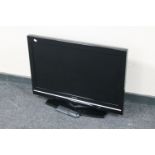 A Toshiba 32 inch LCD TV with remote