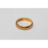 A 22ct gold band ring CONDITION REPORT: 6.