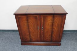 An inlaid mahogany Strongbow double door audio cabinet