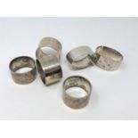 Three pairs of heavy gauge silver serviette rings, 314g.