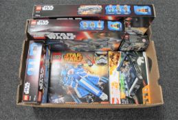 A box of six boxed Lego Star Wars sets - 75140, 75147, 75138, 75087,