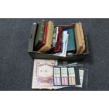 A box of a quantity of stamp albums containing a large collection of assorted stamps,