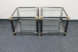 A pair of metal and glass lamp tables