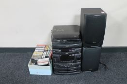 An Akai hifi system and speakers together with a box containing cassette tapes