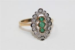 A 9ct gold emerald and diamond ring