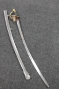 A reproduction brass handled cavalry sword in sheath