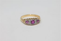 An 18ct gold ruby and diamond ring