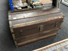 An early 20th century wooden bound travelling trunk