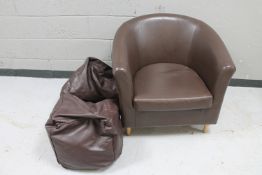 A brown leather tub chair,