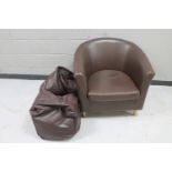 A brown leather tub chair,