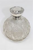 A silver mounted cut glass dressing table bottle