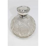 A silver mounted cut glass dressing table bottle