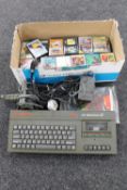 A box of Sinclair 128 KZX Spectrum plus 2 with joy stick, leads,