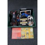 A box of remote control car, die cast vehicles, Cluedo board game,