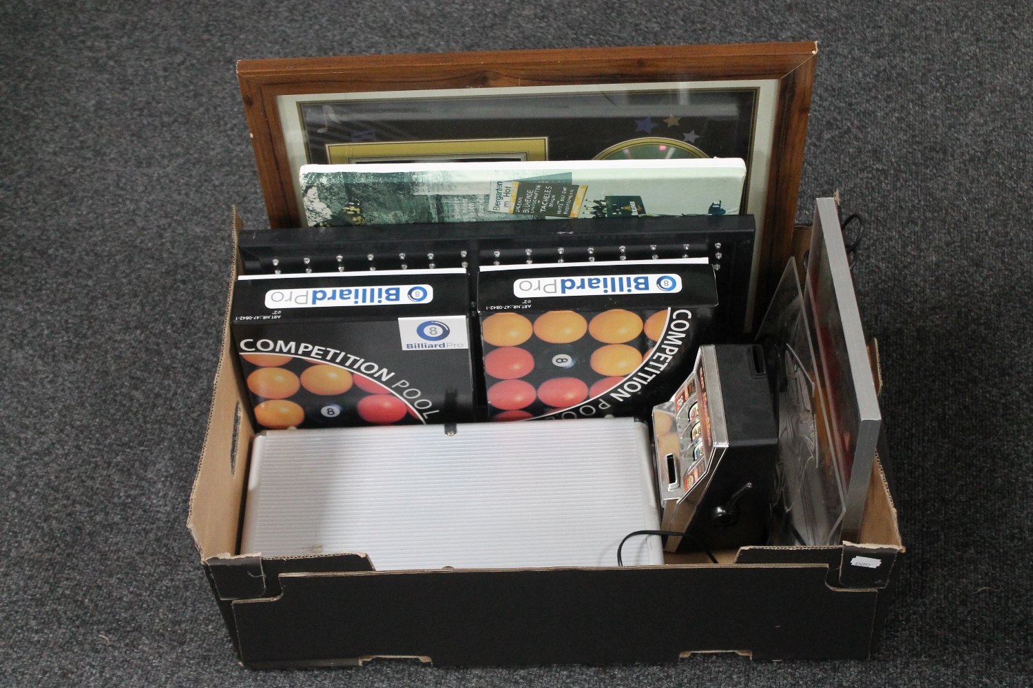 A box of two sets of billiard balls, miniature slot machine,