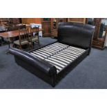 A leather 4' 6" bed frame