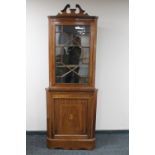 A Victorian inlaid mahogany astragal glazed corner cupboard