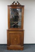 A Victorian inlaid mahogany astragal glazed corner cupboard