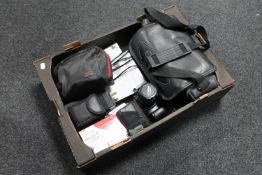 A box of assorted cameras to include a Canon EOS 1000F, Fujifilm Instant Camera,