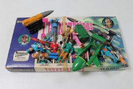A Waddingtons Thunderbirds game together with a box containing Thunderbirds toys and figures