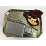 A Meerschaum pipe in case together with two plated cigarette holders, a Ronson lighter,