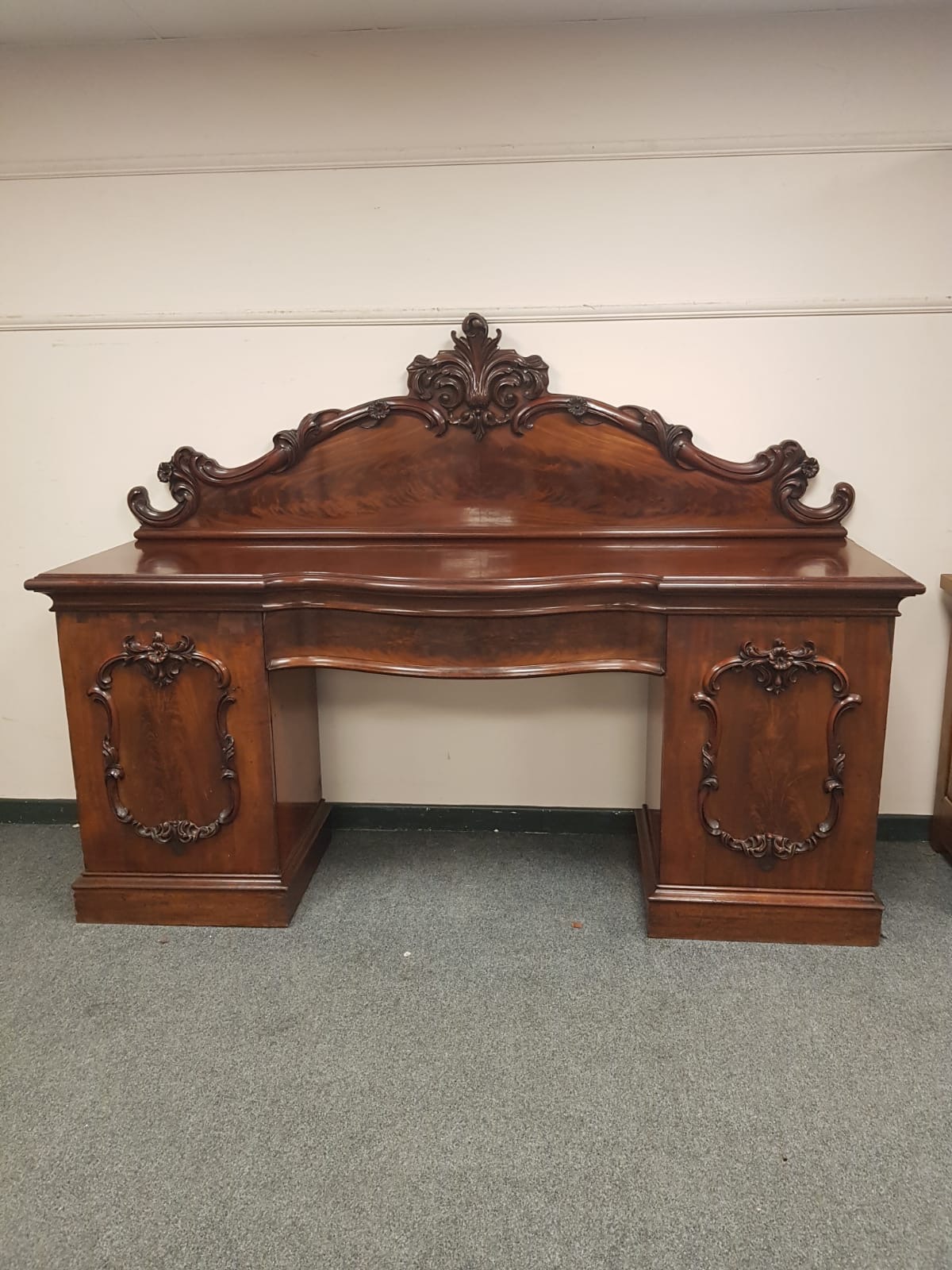 A Victorian mahogany pedestal serpentine fronted sideboard, width 215 cm.