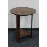 A circular oak Arts & Crafts occasional table