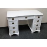 A painted Edwardian dressing table fitted nine drawers (no mirror)