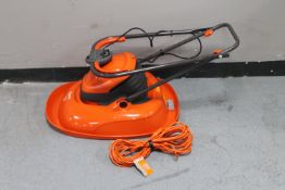 A Flymo lawn mower with lead