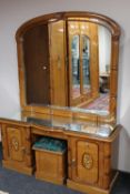 An oriental style parcel gilt kneehole mirror-back dressing table and stool