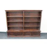 A 20th century mahogany open bookshelves fitted two double door cupboards beneath