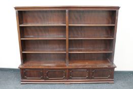 A 20th century mahogany open bookshelves fitted two double door cupboards beneath