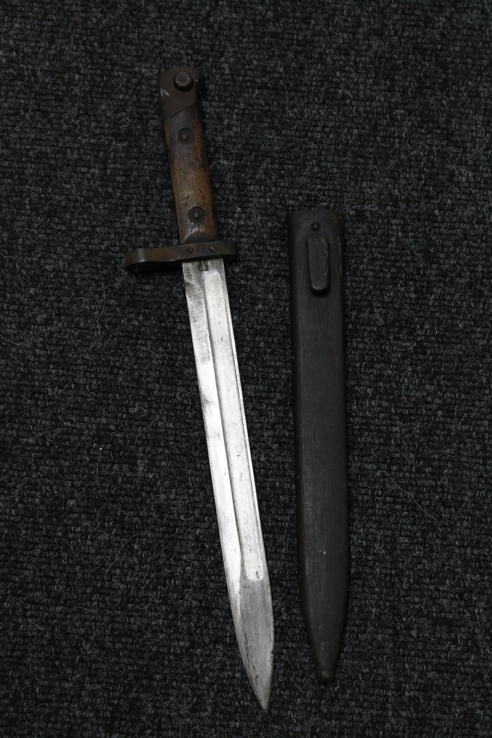 A Hungarian WWII bayonet in scabbard stamped FGGY to blade