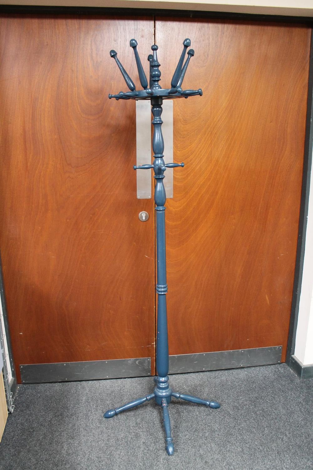 A painted hat and coat stand