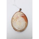 An antique 9ct rose gold cameo pendant depicting Leda and the Swan