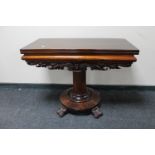 A Victorian mahogany pedestal turnover top tea table