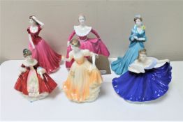 Two Royal Doulton miniature figurer; Southern Belle HN 3174 and Elaine HN 3214,