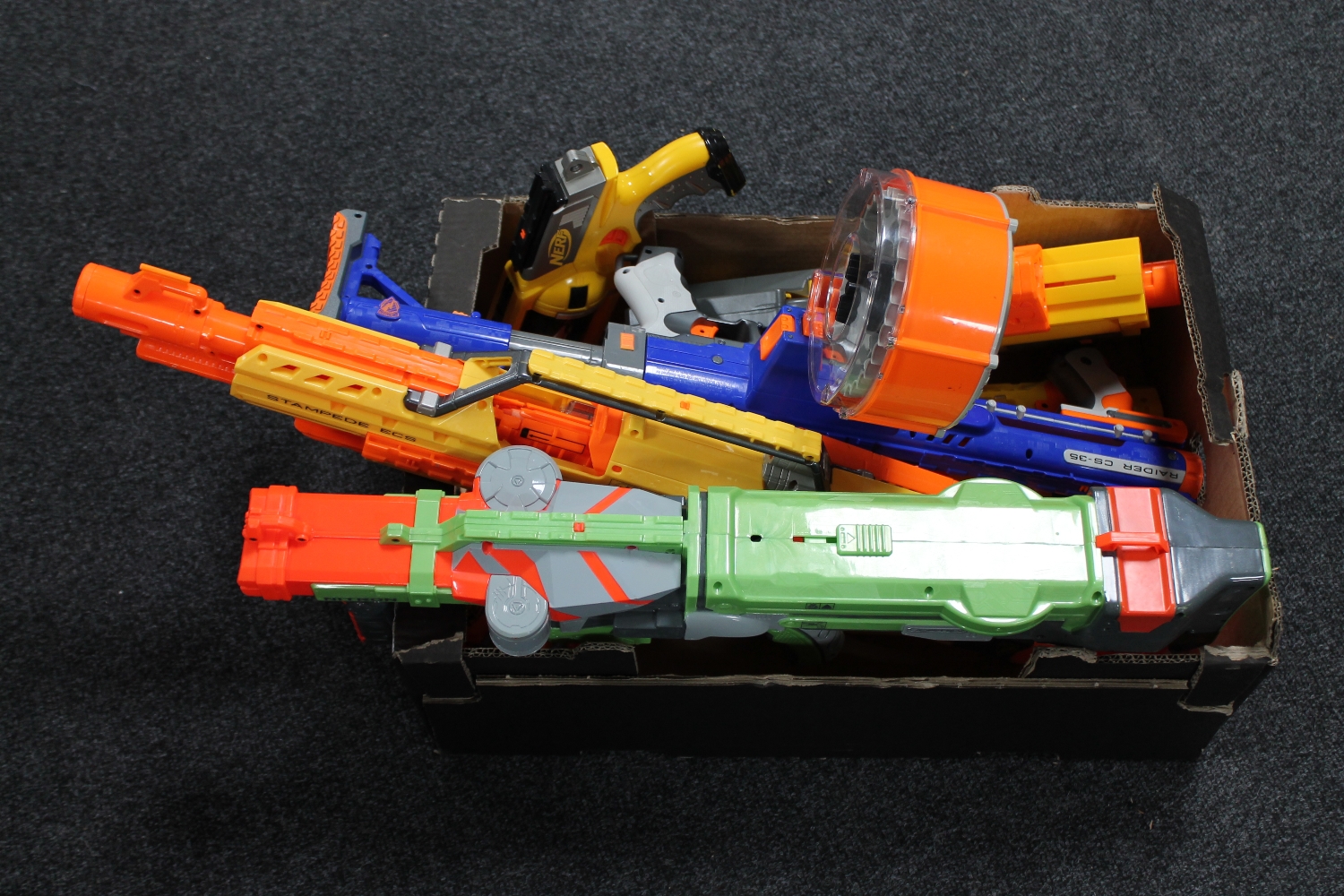 A box containing Nerf guns and accessories