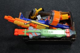 A box containing Nerf guns and accessories