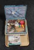 A tray containing a mid 20th century sewing box with contents together with a tin containing