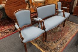 A three piece continental salon suite comprising settee and two armchairs