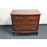 A 20th century continental mahogany bowfront three drawer chest