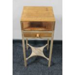 An antique pine occasional table fitted a drawer